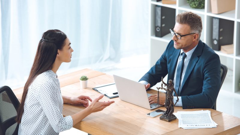 high-angle-view-of-lawyer-working-with-client-in-office.jpg